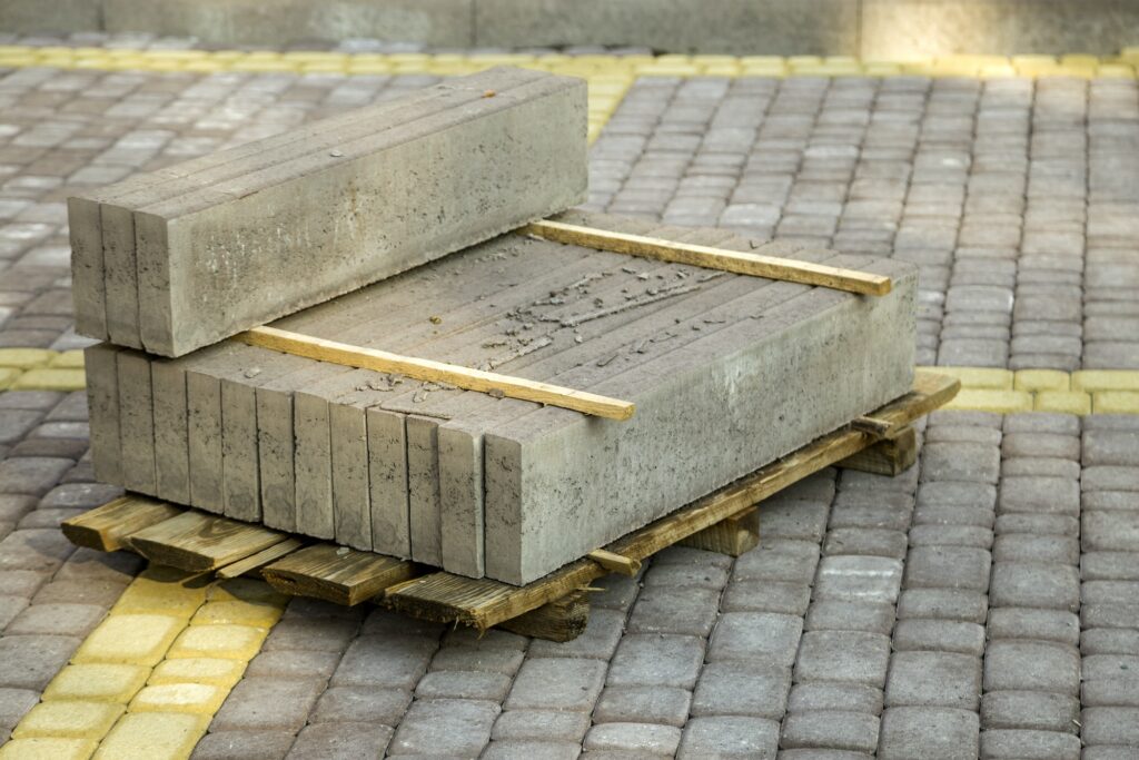 Installation of stone paving slabs in a yard
