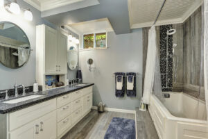 Modern remodeled basement bathroom with sleek fixtures and neutral tones.