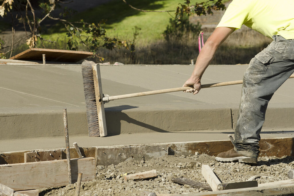 Crafting a Broom Finish on a New Concrete Driveway