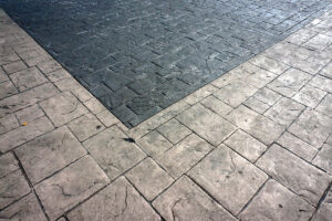 Close-up of stamped concrete driveway with contrasting integrated colors.