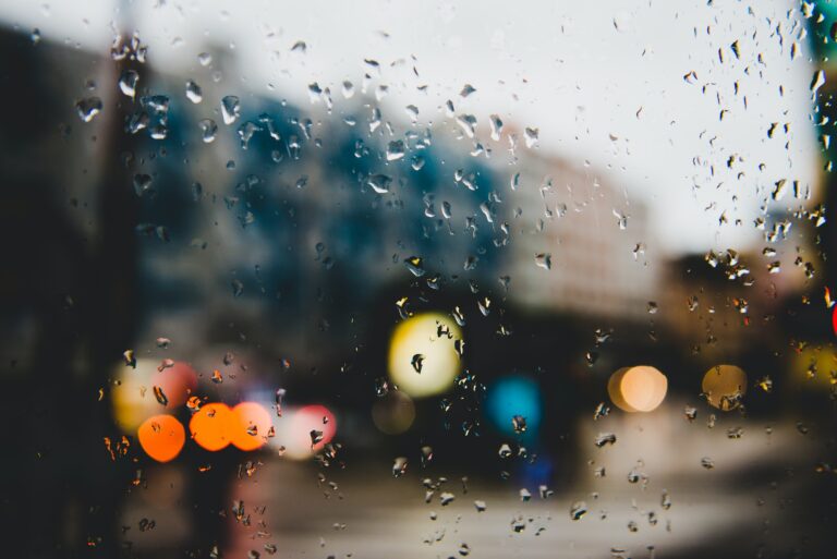 Street with lights through glass with spots